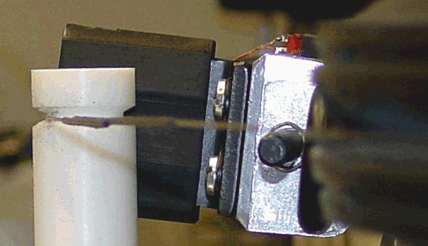 Mechanics: detail of Teflon tensioner device. Also shows splice in heavy gauge wire.