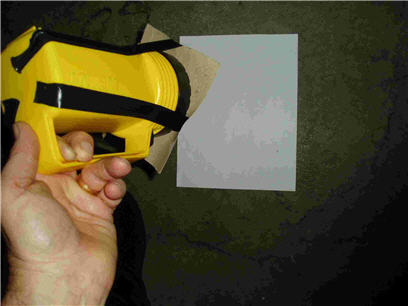 The slit is attached to the front of the lantern flashlight. The slit image is projected onto a screen about 0.3&nbsp;meter away.