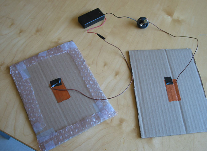 Electricity Science Project This figure shows a prototype of a dance pad with a simple lightbulb circuit.