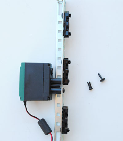 The motor is connected to the metal rail with plastic bearing pop rivets.
Robotics science project