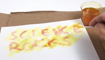 writing 'Science Rocks' with invisible ink for activity