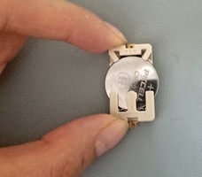Coin cell battery in coin cell battery holder. 