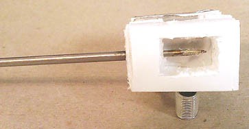 A probe inserted into the center of a sunshield
