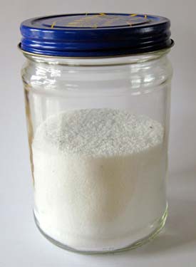Glass jar filled with a mixture of salt and iron filings
