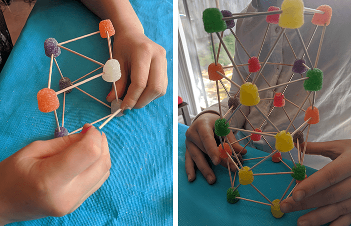 Students exploring shapes other than geodesic dome with gumdrop and toothpick structures