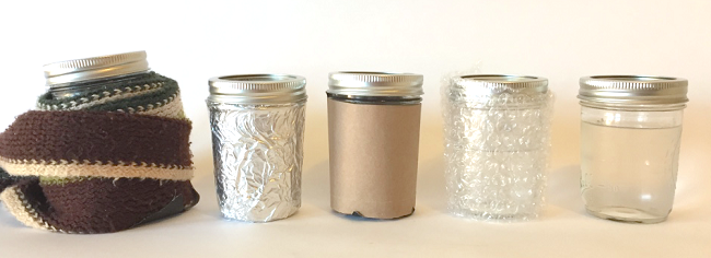 Five mason jars each except the last insulated with different materials: wool, aluminum foil, paper, and bubble wrap.