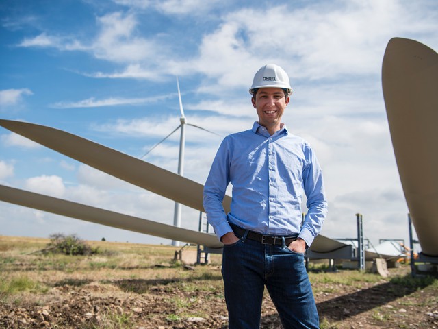 Engineer infront of windmill