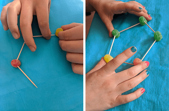 Students getting started connecting gumdrops and toothpicks to build geometric shapes