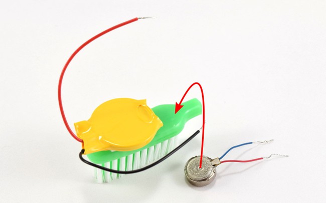 Attach motor to toothbrush.