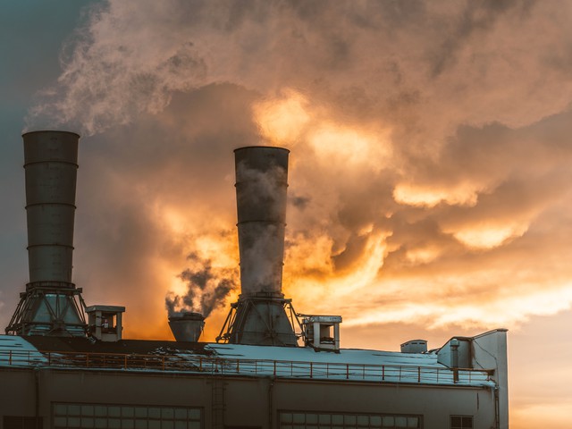 refinery tower with smoke