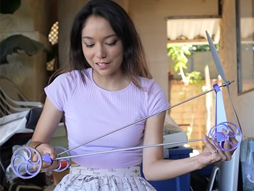 Xyla Foxlin with her prototype of the 'impossible' wind-powered car Blackbird.