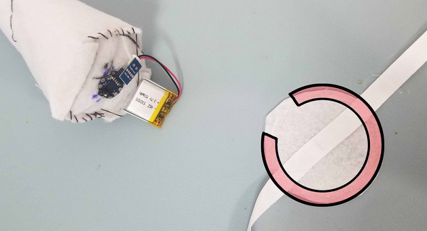Open ring indicating where hot glue should be placed on Felt Piece B. 