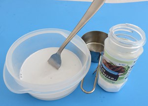 A white proteases solution in a plastic container made from meat tenderizer and water