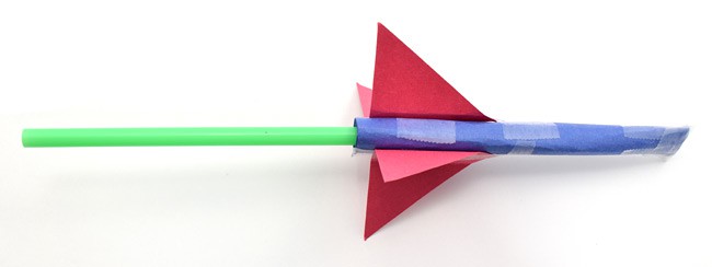 Paper rocket attached to a straw