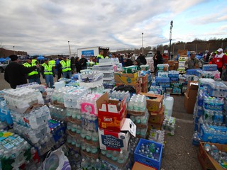 food and water stacked up to be distributed for hurricane Sandy relief