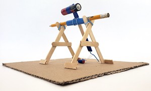 A  mini trebuchet built from office supplies.  