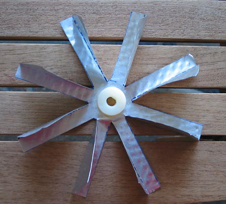 A waterwheel cut from an aluminum pie pan