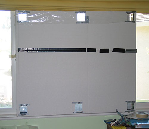 A solar air heater is installed in the frame of a window