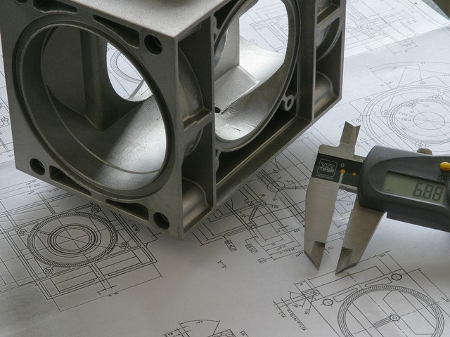 metal parts measured correctly on top of blueprint