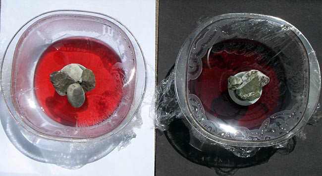 Two bowls collect condensation, the left bowl sits on a white surface while the right bowl sits on a black surface