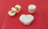 Hard-boiled eggs shaped as a cylinder, heart, and cut up rectangle