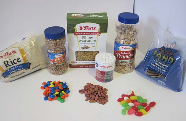 Different granular materials such as rice, nuts, macaroni, sprinkles, sand, beans, M&M's and jellybeans