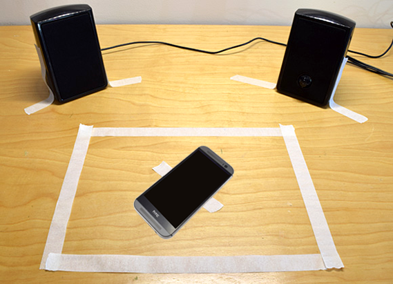 Speakers and phone set up in a designated test area for sound blocking lesson
