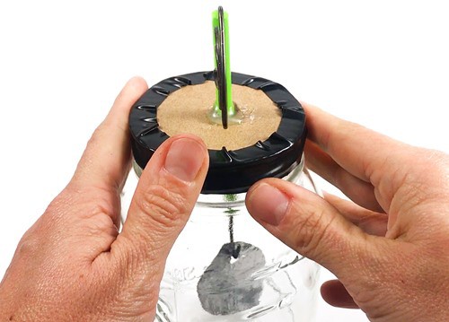 Completed homemade electroscope with taped lid.