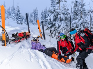 snowboarder with ski patrol