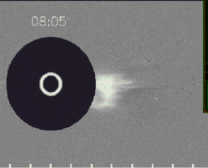 A coronagraph shows a large white flare emerging from the surface of the Sun with a timestamp of 8:05