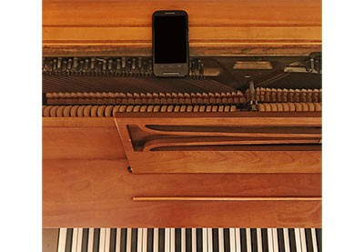 smartphone placed on piano