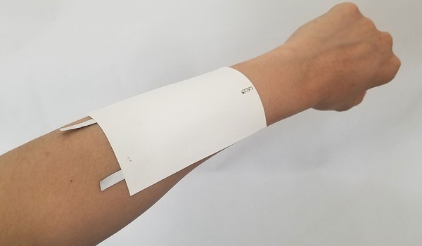 Temporary tattoo adhered to forearm. 