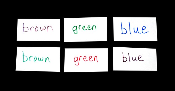 Flash cards set up with colored inks and names of colors for Stroop effect test