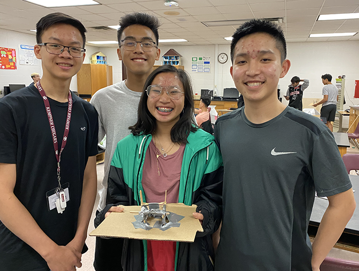Photo of a team of four students with their Cricket Wicket Knockdown solution for the 2020 Fluor Challenge