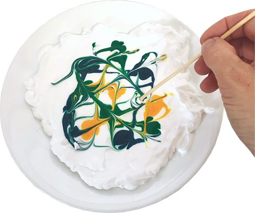 Carefully swirl the colors with a toothpick.