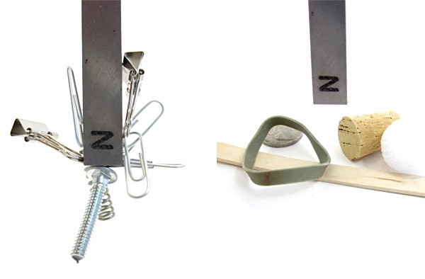 Photo of metal objects stuck to a bar magnet next to a photo of a rubber band, cork, wood and stone near a bar magnet