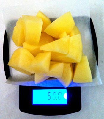 50 grams of small chunks of potato are weighed on a scale