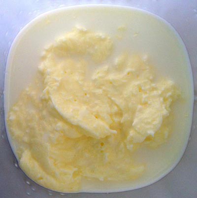 Butter separating from milky liquid
