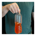 Hand holding a plastic bottle partially filled with liquid and ready to flip - Awesome Summer Science Experiments