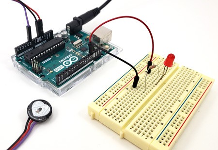 A completed heart rate monitor circuit made from a breadboard, Arduino Uno and pulse sensor