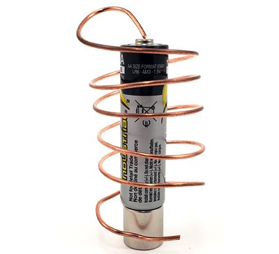 AA battery on top of a cylindrical neodymium magnet, with a copper wire wrapped around it in a spiral. 