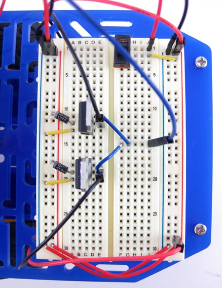A fully wired breadboard for a motion-detecting robot