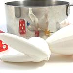 Explore curved reflections of small objects in a shiny cup or pot
