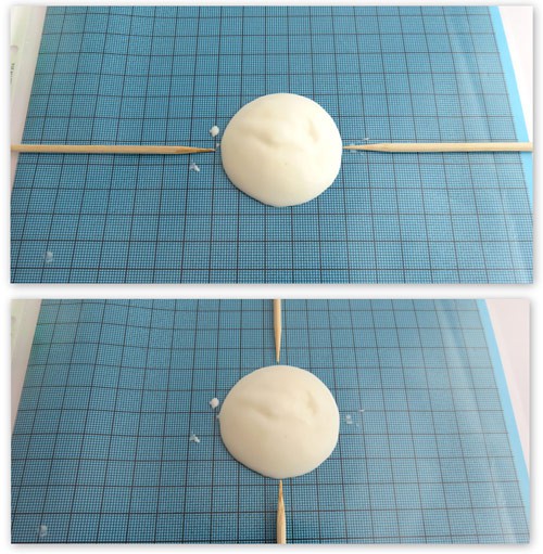 Toothpicks are used to measure the widest and tallest points of a piece of ice cream placed on graph paper