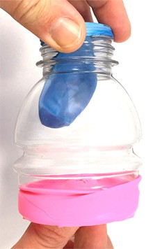 The lung model with a deflated balloon as the knot is being pushed in