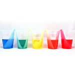 Colorful display of water moving between cups of colored water