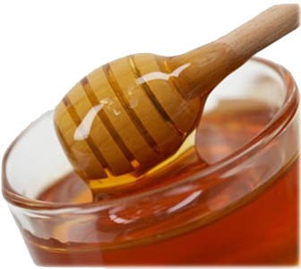 A honey wand in a bowl of honey