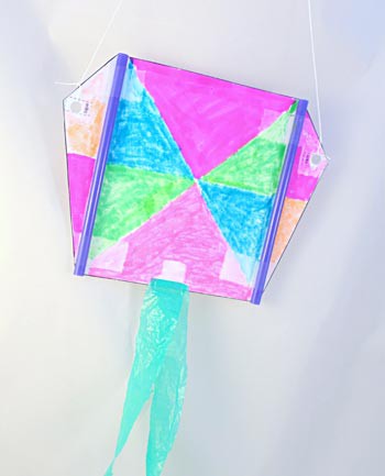 Homemade sled kite with plastic bag tails