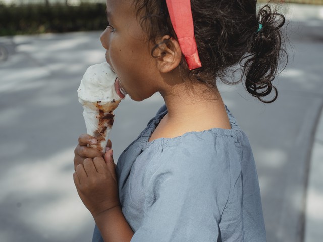 kid licking ice cream