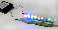 A circuit made from a battery pack, clay and ten LEDs in parallel